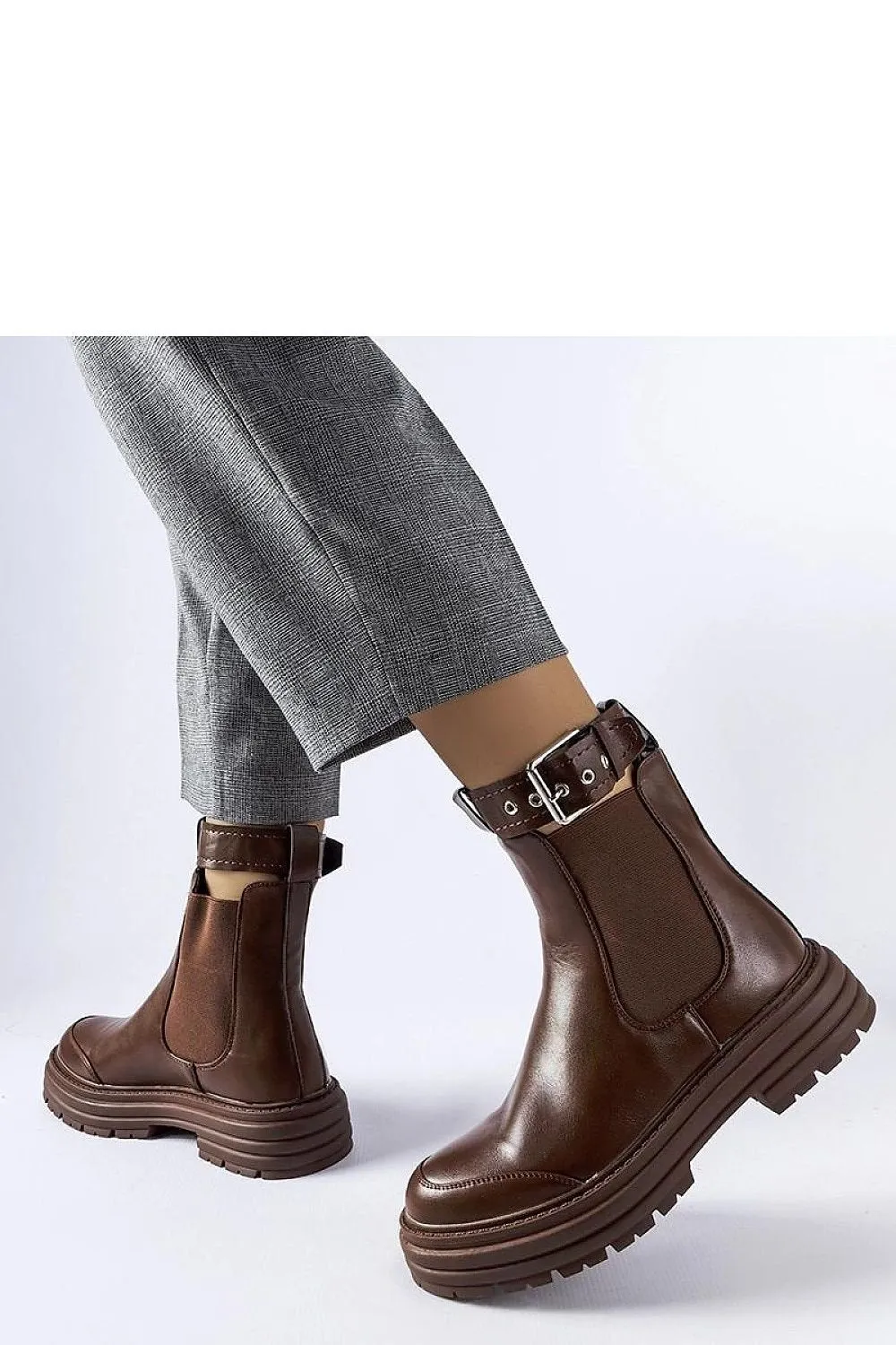 Black ankle boots with decorative fastening
