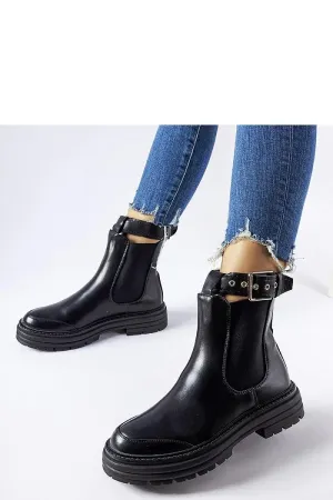 Black ankle boots with decorative fastening
